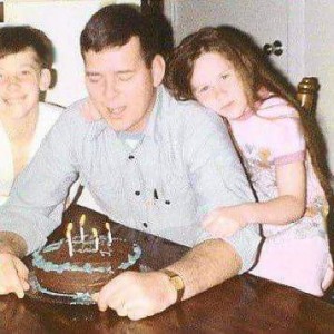 My brother, Dad, and me on Dad's birthday. I am about age 9 in the picture. 